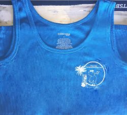 A blue tank top with a white printed graphic on the chest area featuring a silhouette of a person playing guitar under a palm tree with text that appears to say "St John's Bay.