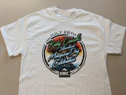 White T-shirt with print promoting "Ricky Carroll's International Mangrove Day Celebration" on July 26th, featuring a colorful design with trees, sunset, and the initials "MRC" at the bottom.