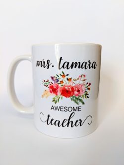 White ceramic mug with floral design, reads "mrs. tamara AWESOME teaher.